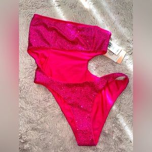 Bright pink swimsuit with bedazzled in pink stones